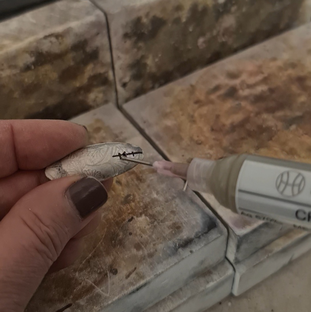 image shows solder being applied to the bail